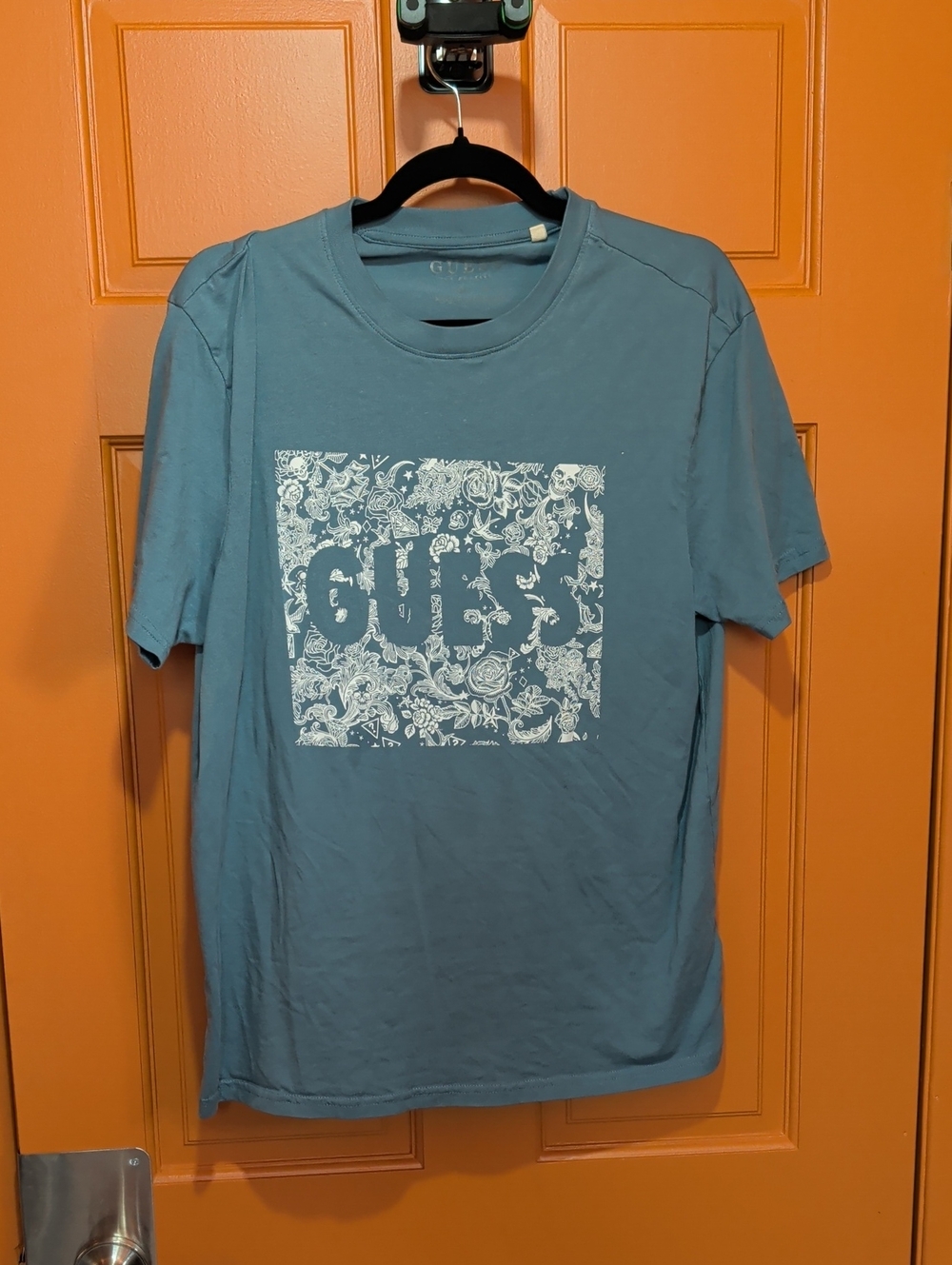 GUESS Men's Blue Tee with White Floral Logo Box